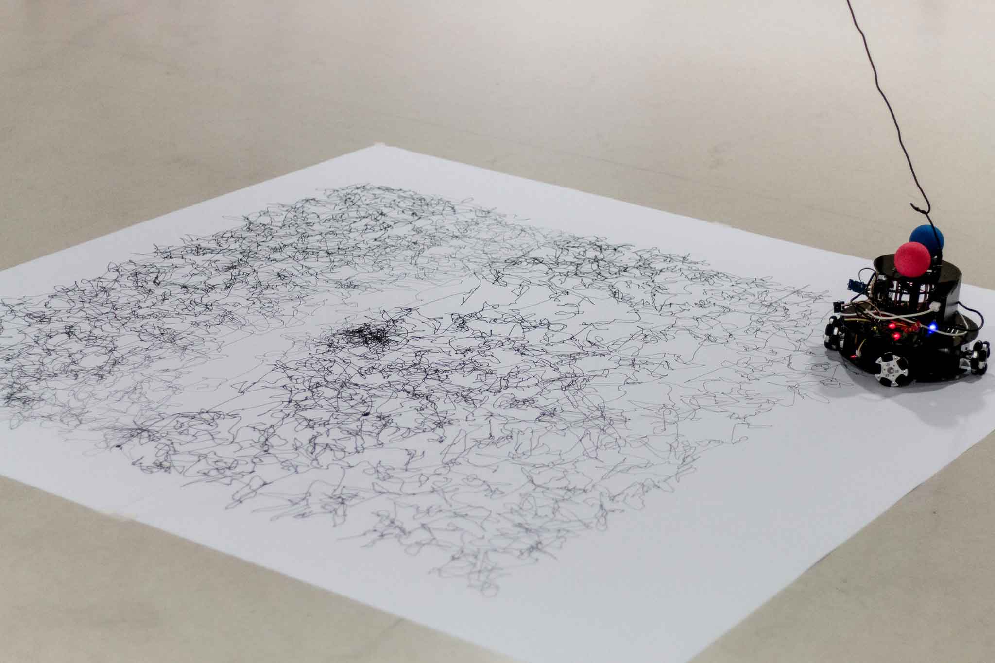 Minus E finishing a drawing of Clay Shirky's Eye